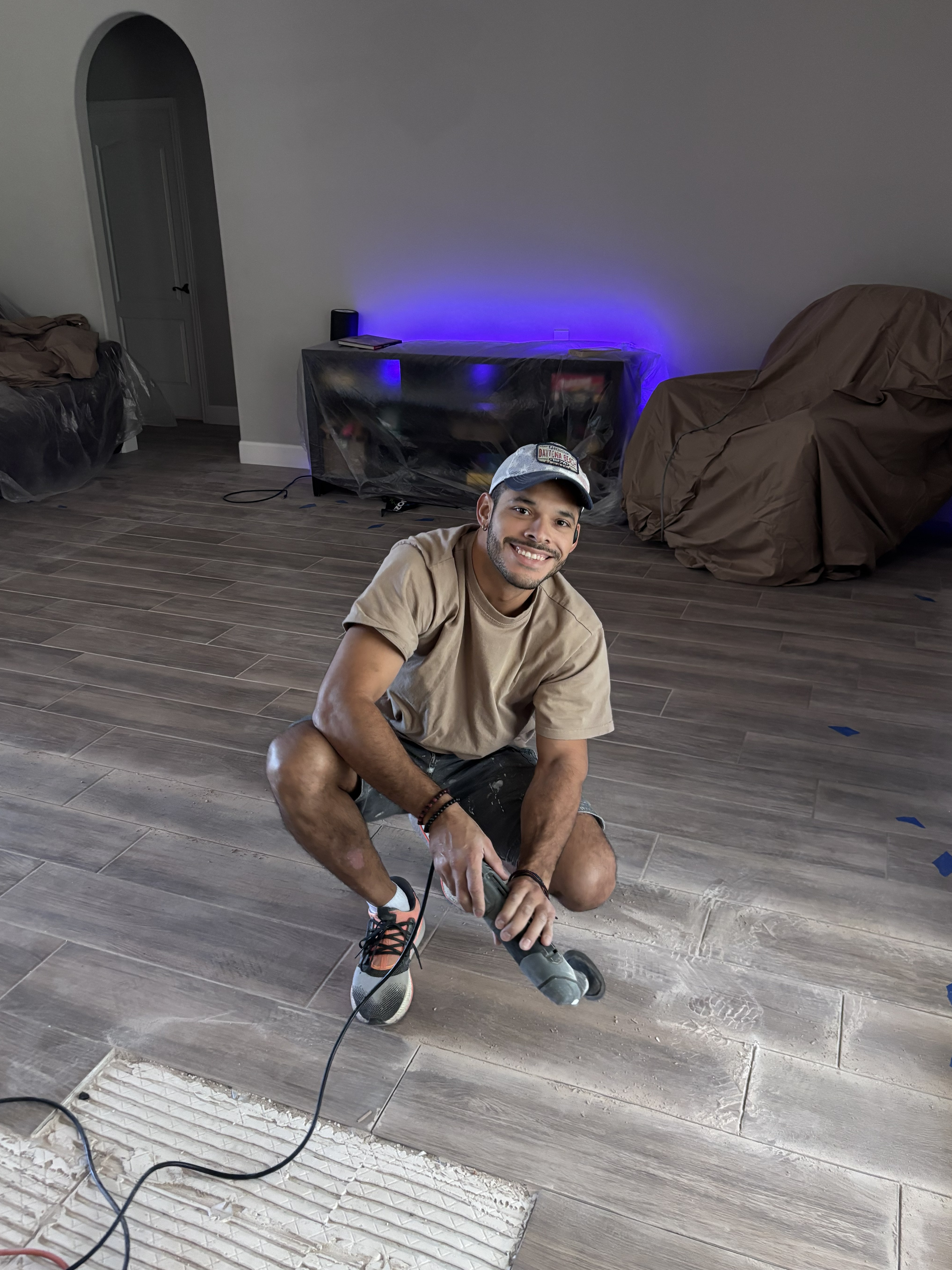Renny working on a tile project